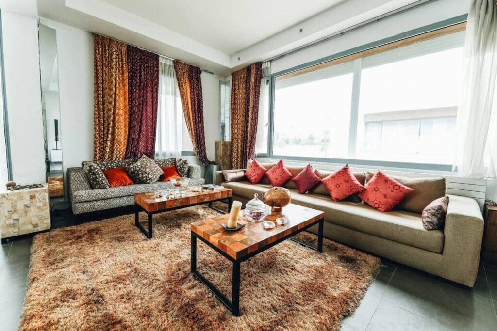 How to Layer Rugs in a Living Room Like a Designer
